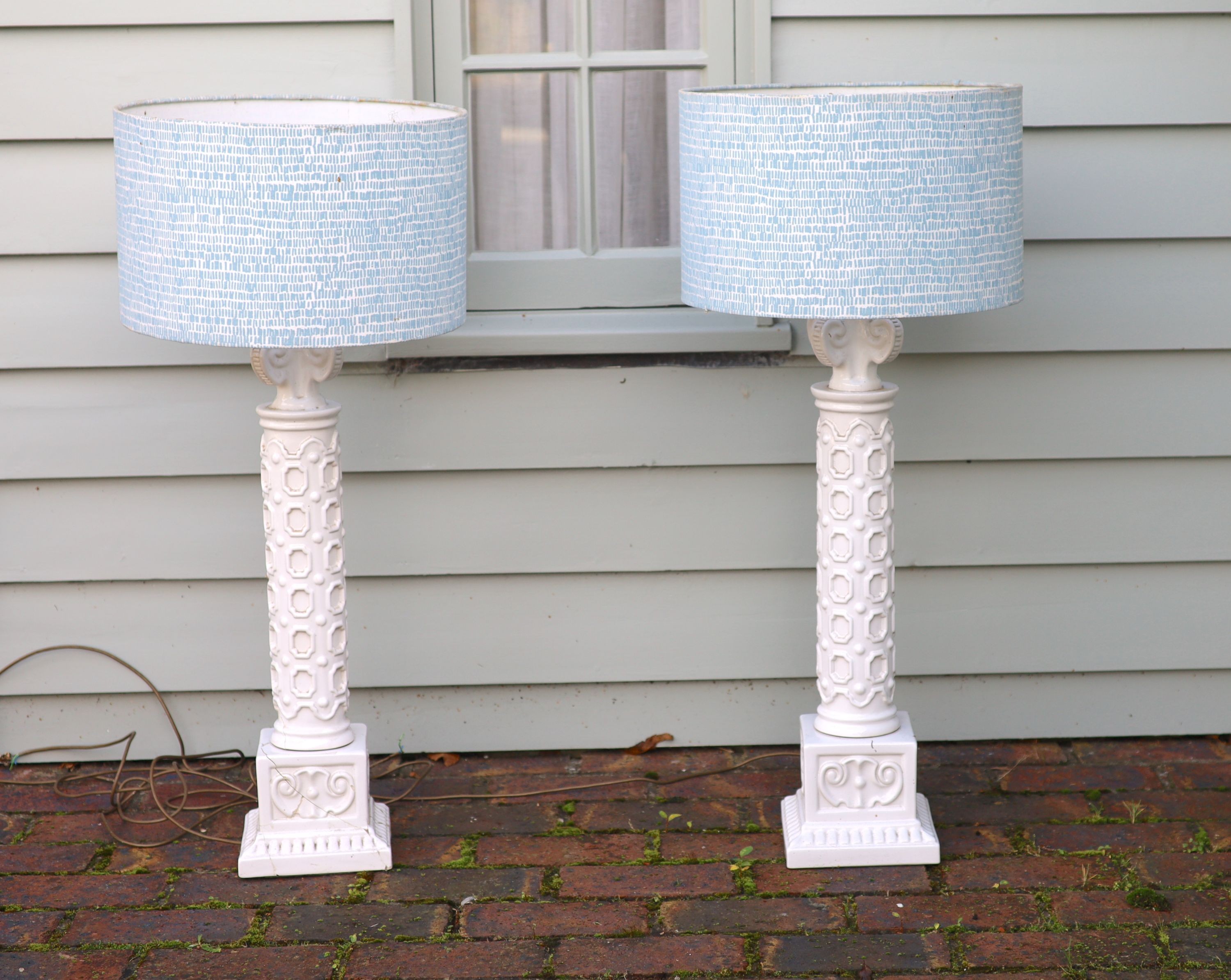 A pair of white glazed pottery table lamps, height to fittings 67cm (one a.f.)